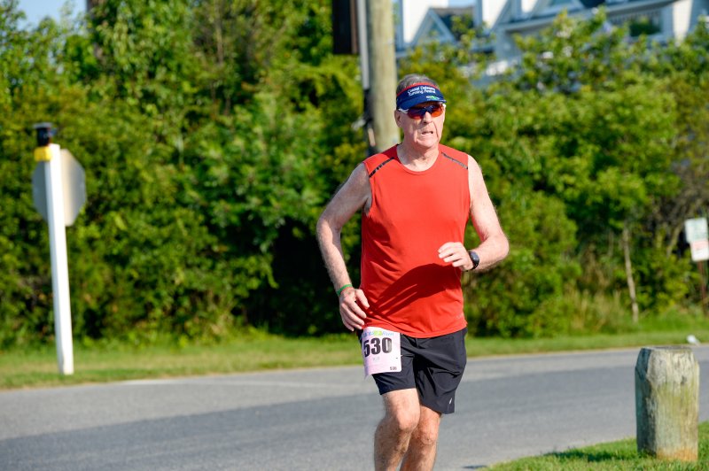 Jules Woodall completes his 199th consecutive Ten Sisters Series race at the Dewey Beach Liquors 5K. DAVE FREDERICK PHOTOS